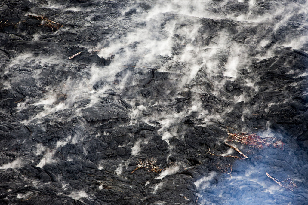 Smoke rises from the lava flow from Mt. Kilauea as it inches closer to the village of Pahoa, Hawaii